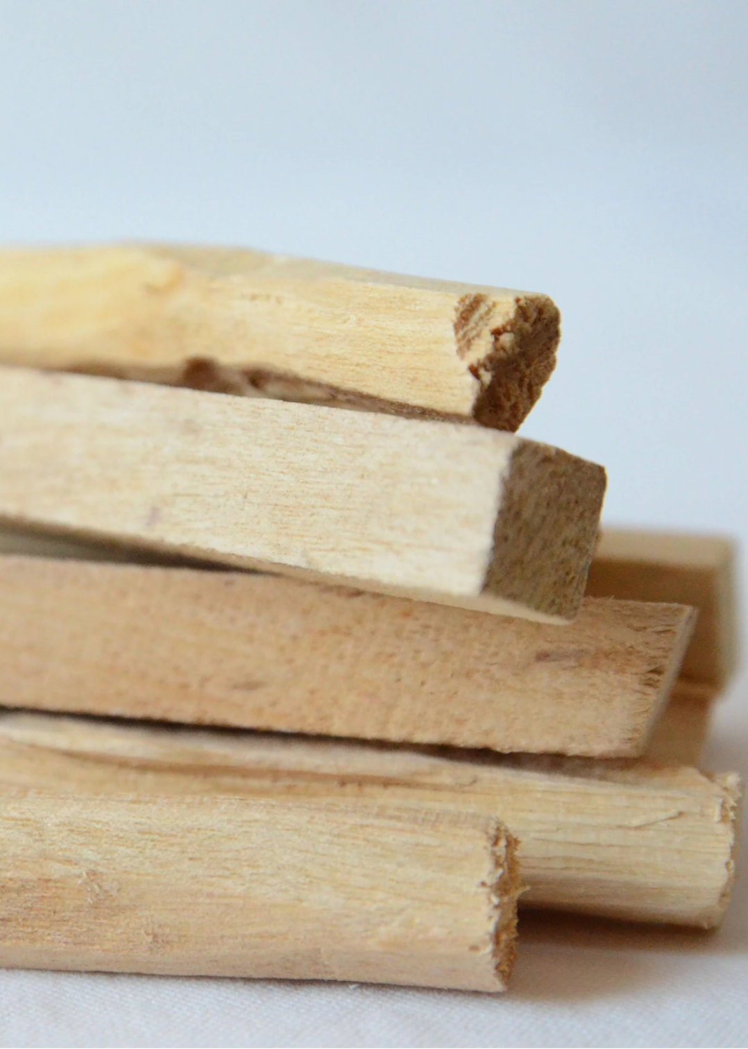 Natural Palo Santo with hints of citrus and mint, ideal for purification and intention setting.