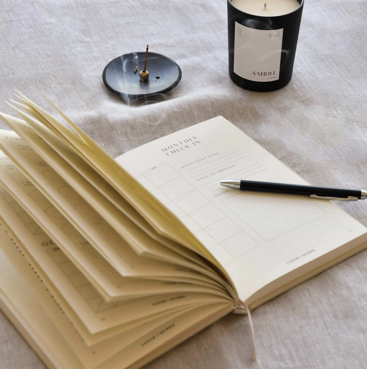 Living with Intent Journal featuring guided prompts for mindfulness, self-reflection, goal-setting, and daily habit tracking for a purposeful and intentional life.