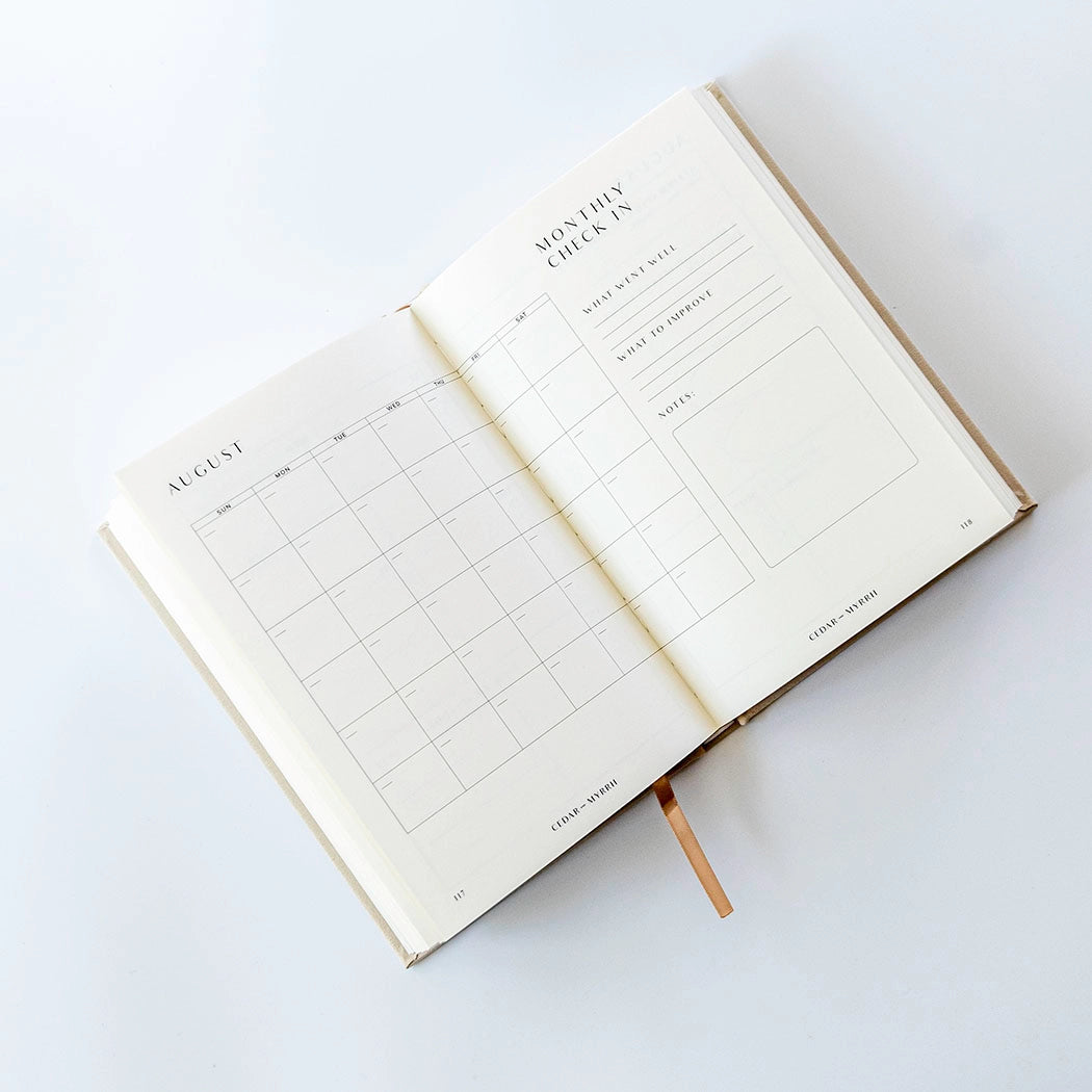 Living with Intent Journal featuring guided prompts for mindfulness, self-reflection, goal-setting, and daily habit tracking for a purposeful and intentional life.