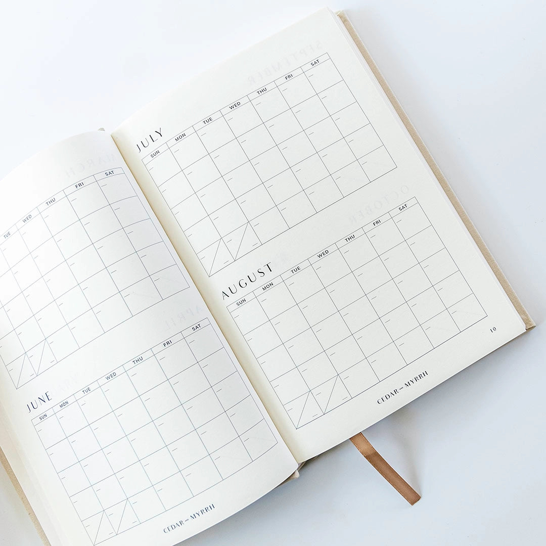 Living with Intent Journal featuring guided prompts for mindfulness, self-reflection, goal-setting, and daily habit tracking for a purposeful and intentional life.