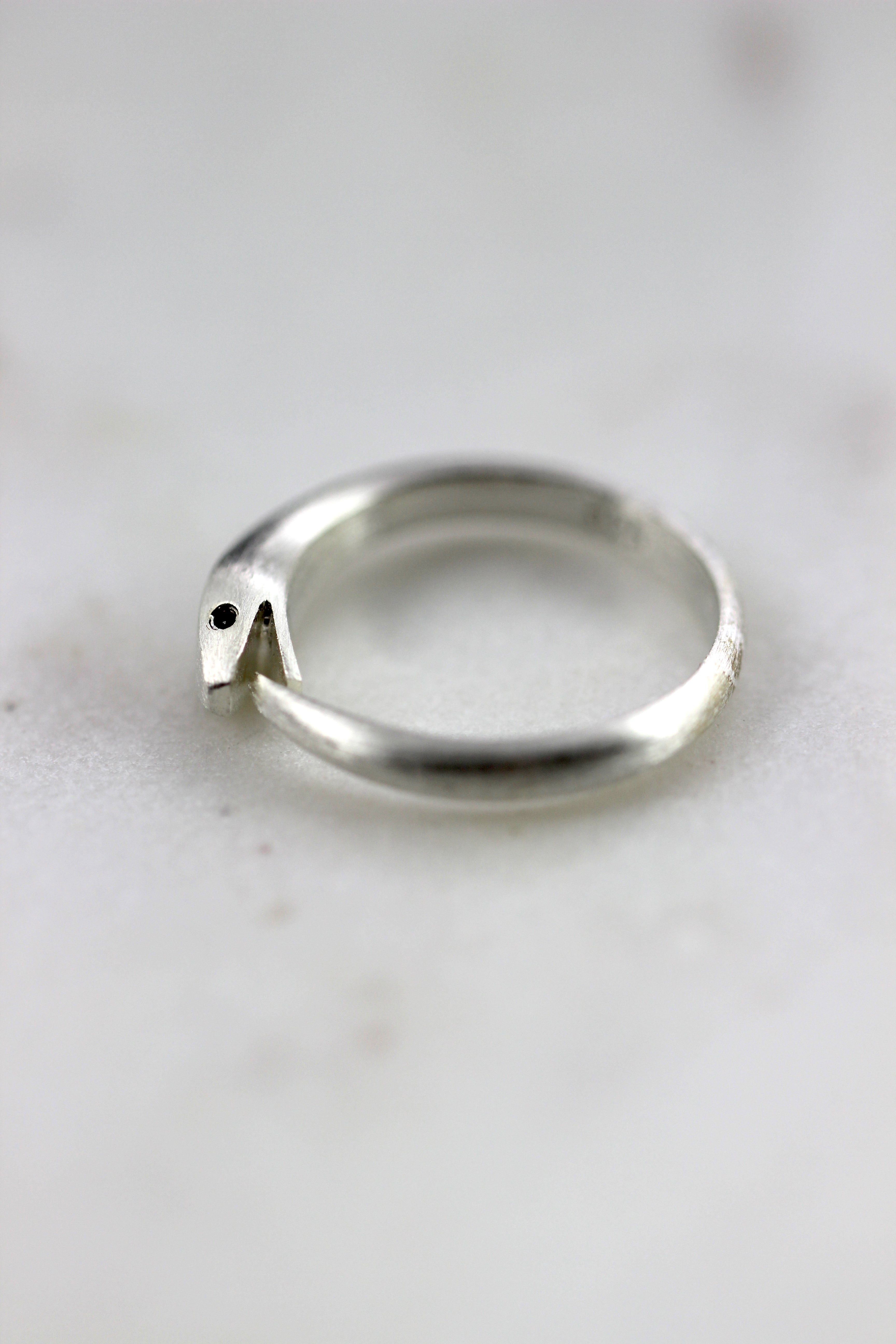 Our elegant sterling silver Ouroboros snake ring in gold, designed for symbolic and statement jewelry lovers.