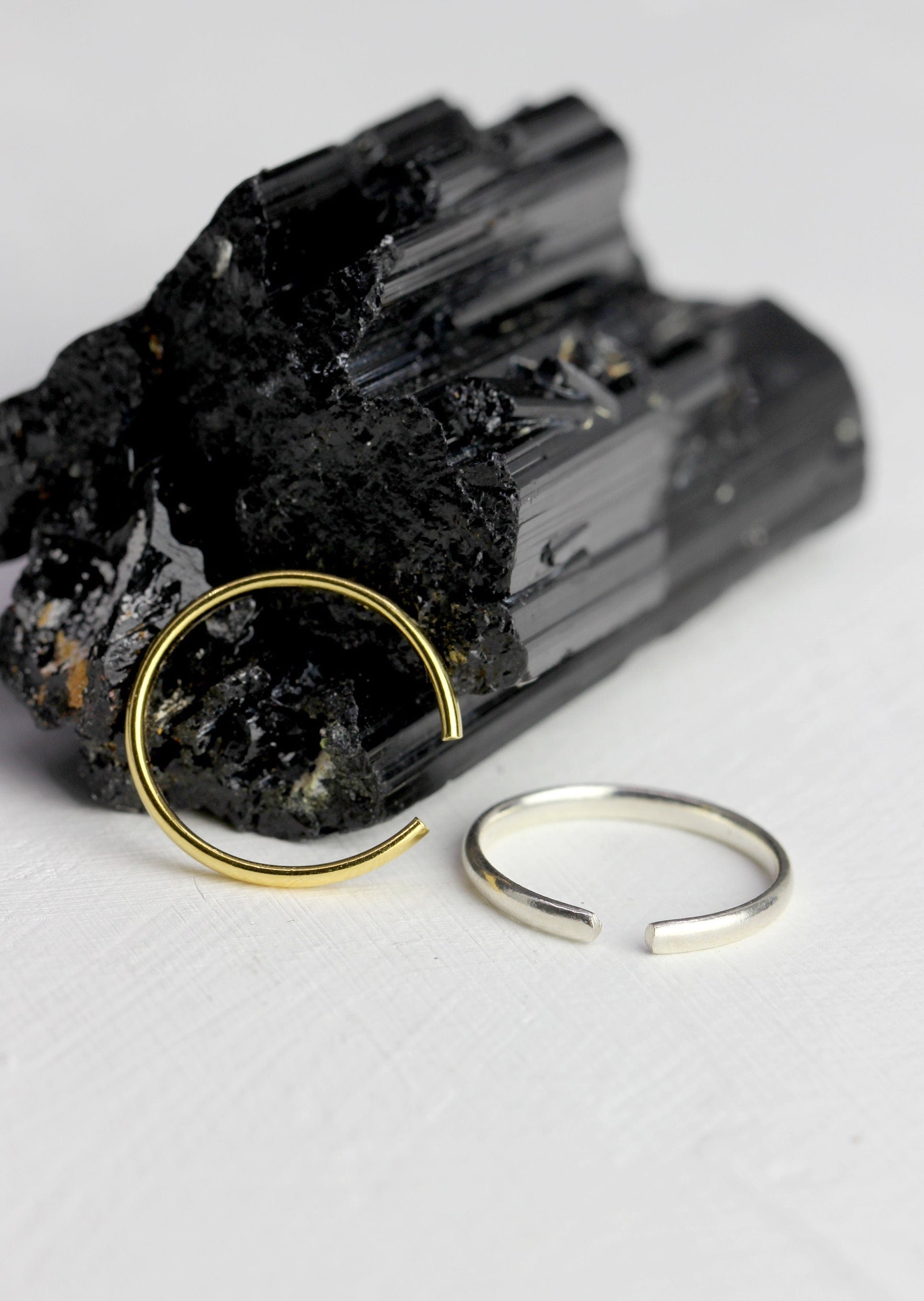 Adjustable Simple Band Ring - A minimalist yet versatile ring that offers both style and comfort. Its adjustable design ensures a perfect fit for any finger size, while the simple band adds a touch of elegance to any outfit. Available in a variety of metals, including Gold, Gold Vermeil, and Sterling Silver, this timeless piece is a must-have for your jewelry collection. This ring is handmade by Blackbird Jewelry.