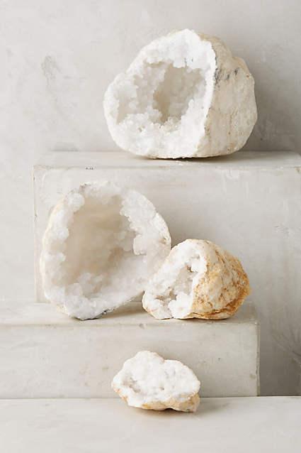 Natural cracked geode with sparkling crystal interior, perfect for home decor.